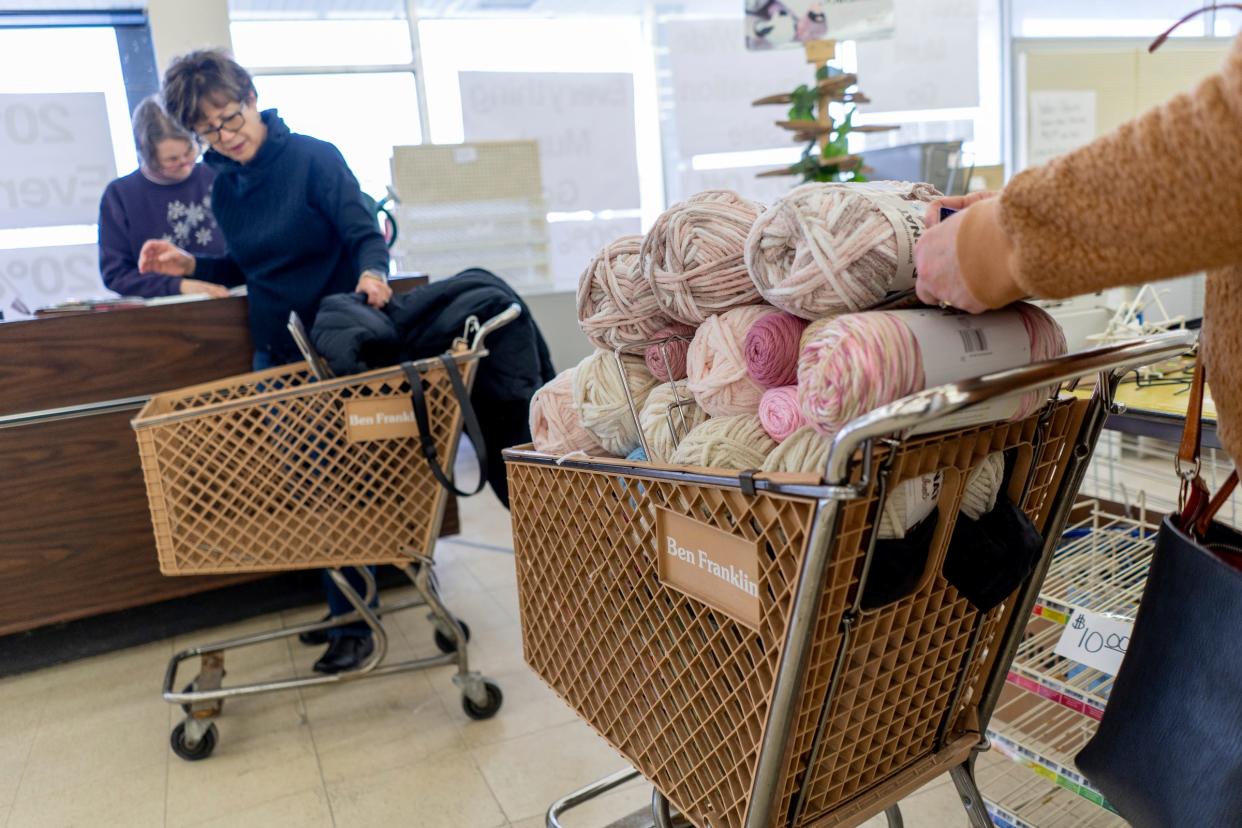 Virginia Norton, left, rings up yarn for Annette Kinter, center, of New Baltimore, and Ava Robinson, right, of Ira, during a closing sale at Springrove Variety in Marysville on Friday, Feb. 2, 2024.