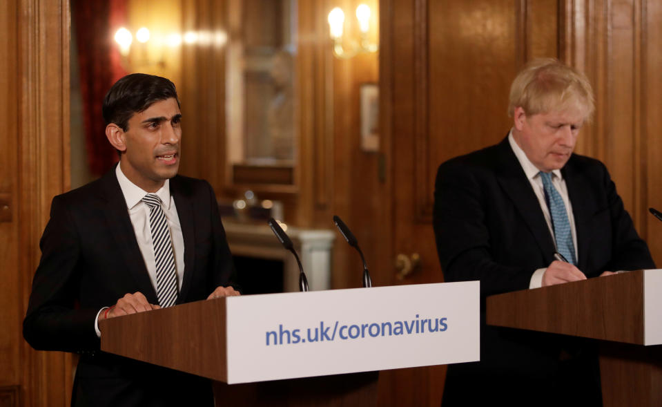 Britain's Prime Minister Boris Johnson and Chancellor of the Exchequer Rishi Sunak attend a news conference on the ongoing situation with the coronavirus disease (COVID-19) in London, Britain March 17, 2020. Matt Dunham/Pool via REUTERS