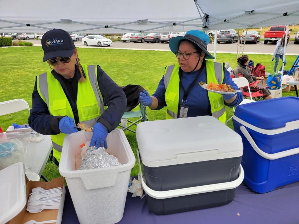 Employees serve food at the Valley Onward event on March 28, 2024 in Livingston, Calif.