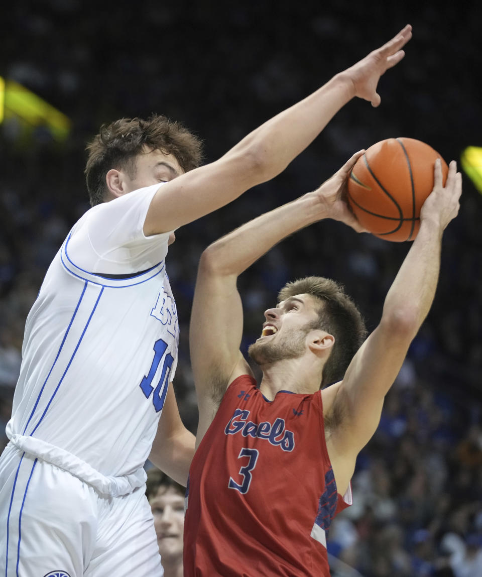 Saint Mary's guard Augustas Marciulionis (3) tries to shoot over BYU forward Tredyn Christensen (10) during the first half of an NCAA college basketball game Saturday, Jan. 28, 2023, in Provo, Utah. (AP Photo/George Frey)