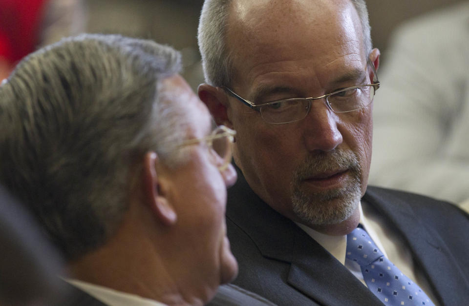 State School Superintendent Tommy Bice, right, talks with Deputy Superintendent Craig Pouncey at the Alabama Statehouse during a meeting of the Senate Finance and Taxation - Education Committee in Montgomery, Ala., Wednesday, April 18, 2012. The committee voted to approve a $5.5 billion education budget for the 2012-2013 school year that is about $150 million smaller than this year's budget. (AP Photo/Dave Martin)