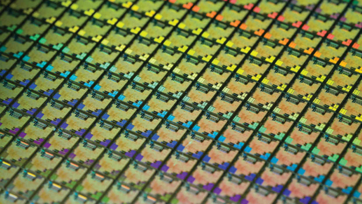 A photograph of a silicon wafer from TSMC, showing multiple rows of individual dies. 