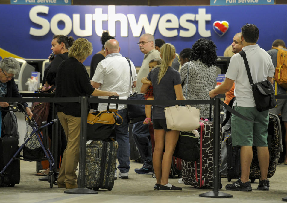 <p>Passengers wait in line at the Southwest Airlines ticket counter Wednesday, Sept. 6, 2017 at Tampa International Airport. Many passengers were leaving Tampa on Wednesday ahead of Hurricane Irma which is threatening the Florida peninsula. (Photo: Chris Urso/Tampa Bay Times via AP) </p>