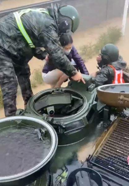Members of South Korea's Marine Corps 1st Division help a civilian climb aboard an amphibious tank during rescue operations in the southern city of Pohang, September 6, 2022, after Typhoon Hinnamnor left many southern regions of the country flooded. / Credit: Republic of Korea Ministry of Defense/Handout