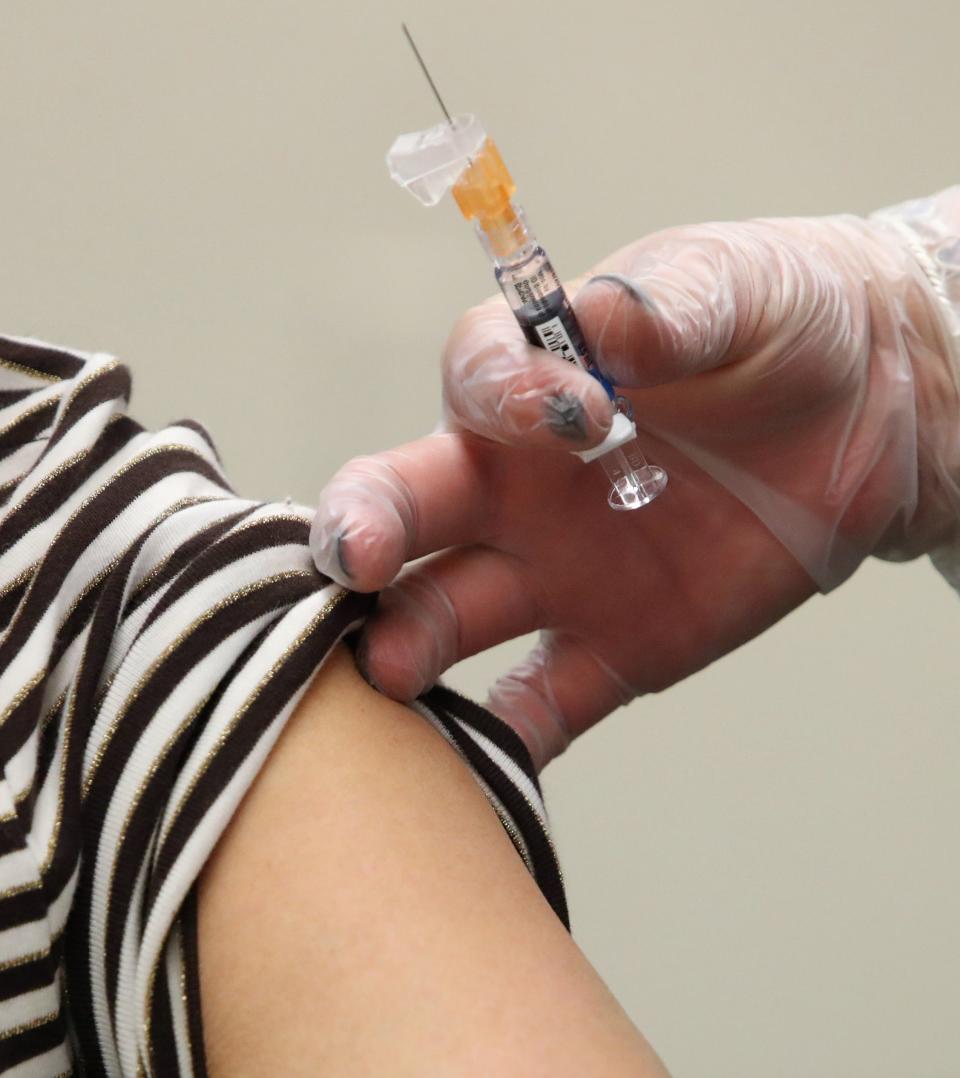 Joan Gordon of New City gets a flu shot at the Pascack Community Center in Nanuet, NY.