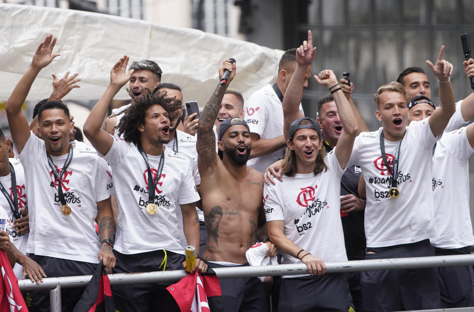 Gabriel of Brazil's Flamengo, center, and teammates parade at their arrival in Rio de Janeiro, Brazil, Sunday, Nov. 24, 2019. Flamengo overcame Argentina's River Plate 2-1 in the Copa Libertadores final match on Saturday in Lima to win its second South American title. (AP Photo/Ricardo Borges)