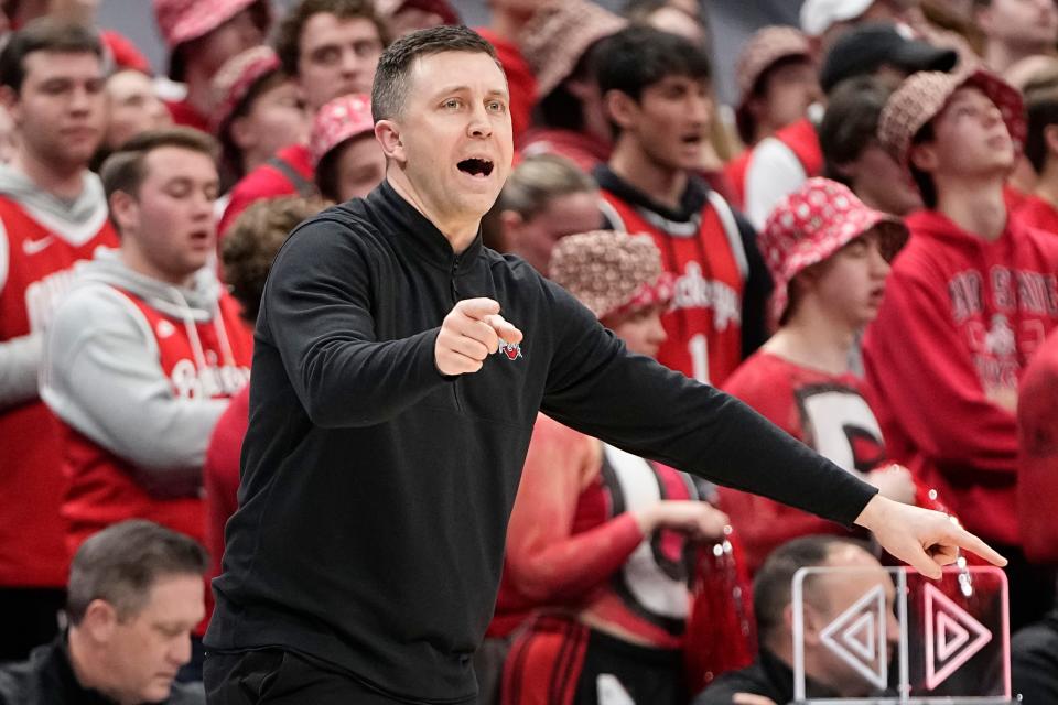 Feb 18, 2024; Columbus, Ohio, USA; Ohio State Buckeyes interim head coach Jake Diebler motions from the bench during the second half of the NCAA men’s basketball game against the Purdue Boilermakers at Value City Arena. Ohio State won 73-69.