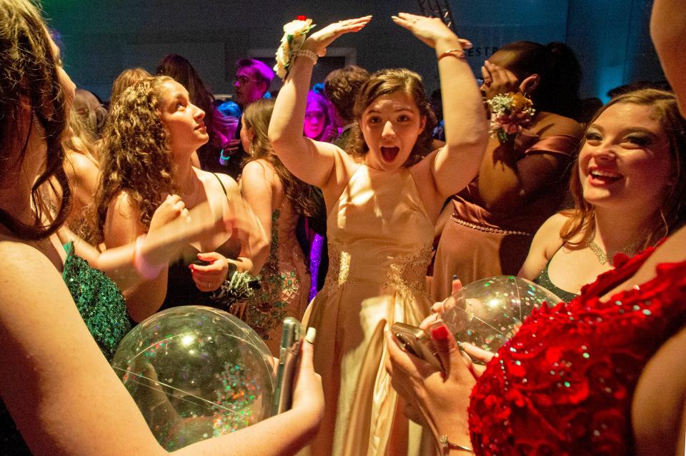 Northwest Pennsylvania Collegiate Academy prom attendees take the dance floor, on May 13, 2022, during the prom held at the Bayfront Convention Center in Erie.