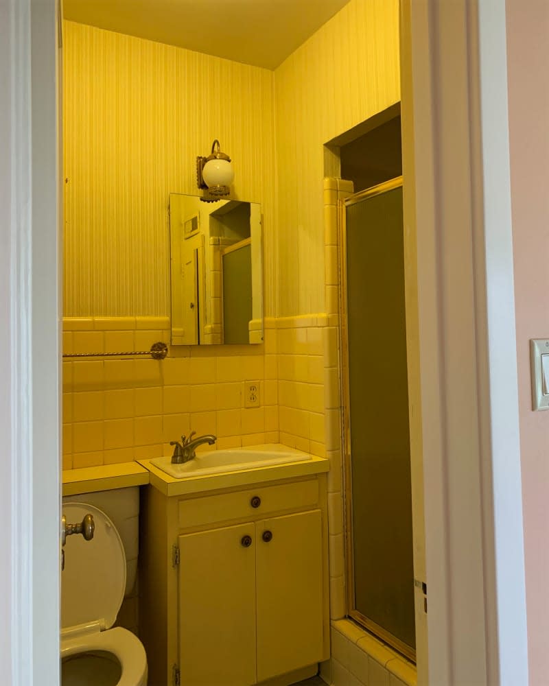 Tiled wainscoting in bathroom before renovation.