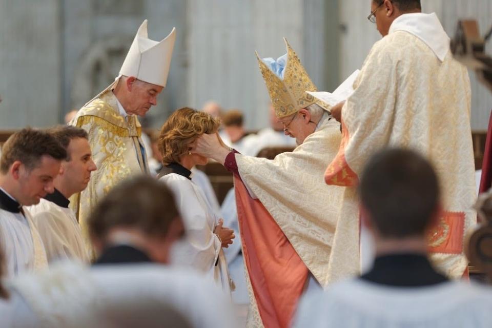 Kristin Breuss being ordained.