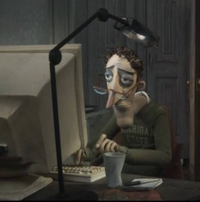 Coraline's dad typing while looking sad in Coraline