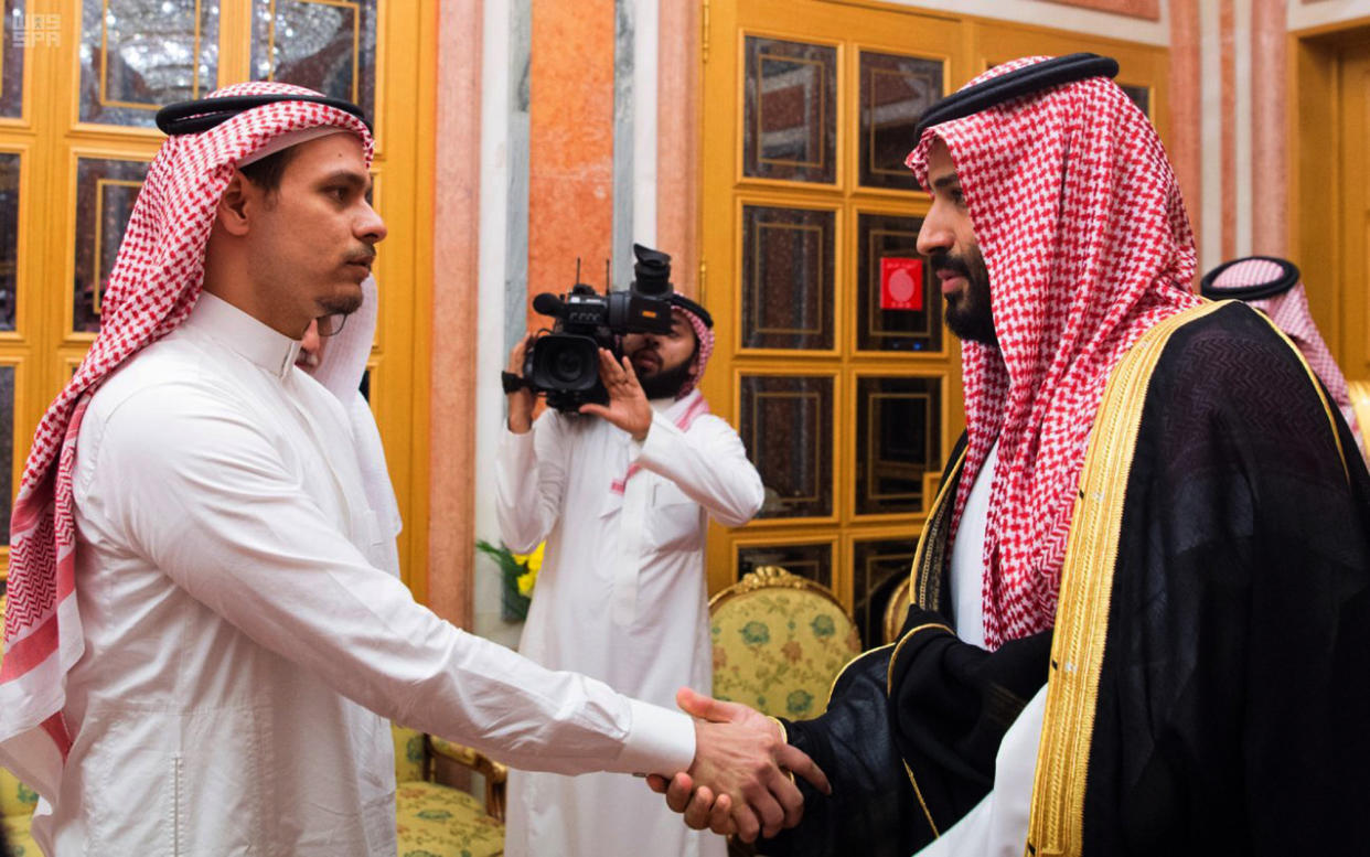 Saudi Crown Prince Mohammed bin Salman (right) shakes hands with Salah Khashoggi, son of Jamal Khashoggi, in Riyadh on Oct. 23, 2018. (Photo: Saudi Press Agency via ASSOCIATED PRESS)