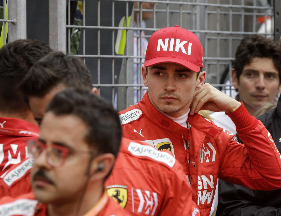 Ferrari driver Charles Leclerc of Monaco watches from outside after he went out of the Monaco Formula One Grand Prix race, at the Monaco racetrack, in Monaco, Sunday, May 26, 2019. (AP Photo/Luca Bruno)