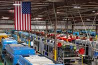 Buses are shown being built at the BYD electric bus factory in Lancaster, California