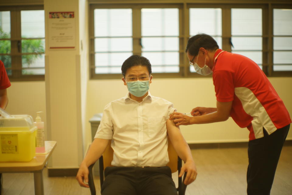 Education Minister Lawrence Wong receives his first dose of COVID-19 vaccination at Kwong Wai Shiu Hospital. (PHOTO: Ministry of Communications and Information)