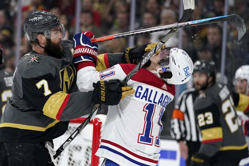 Vegas Golden Knights defenseman Alex Pietrangelo (7) and Montreal Canadiens right wing Brendan Gallagher (11) tussle during the first period in Game 5 of an NHL hockey Stanley Cup semifinal playoff series Tuesday, June 22, 2021, in Las Vegas. (AP Photo/John Locher)