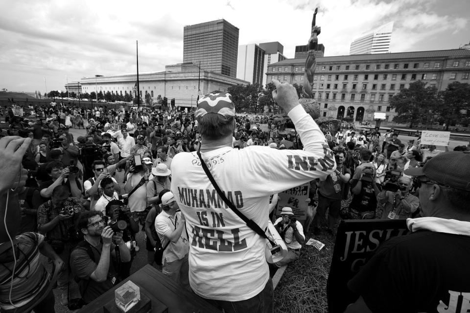 <p>A member of the group Bible Believers argues with anti-Trump demonstrators in Cleveland. (Photo: Khue Bui for Yahoo News)</p>