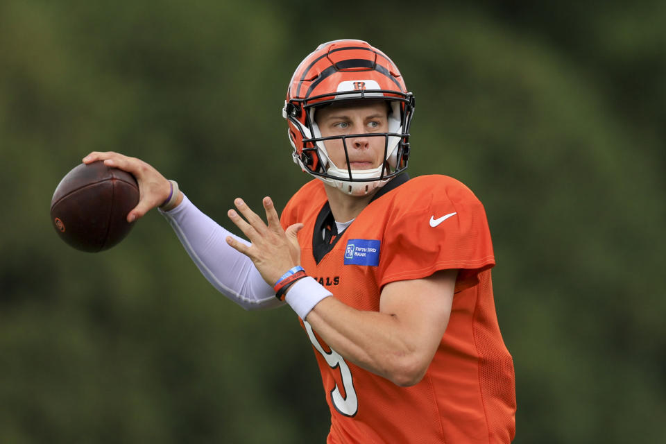 Cincinnati Bengals' Joe Burrow throws a pass throws a pass during NFL football training camp in Cincinnati, Monday, Aug. 15, 2022. (AP Photo/Aaron Doster)