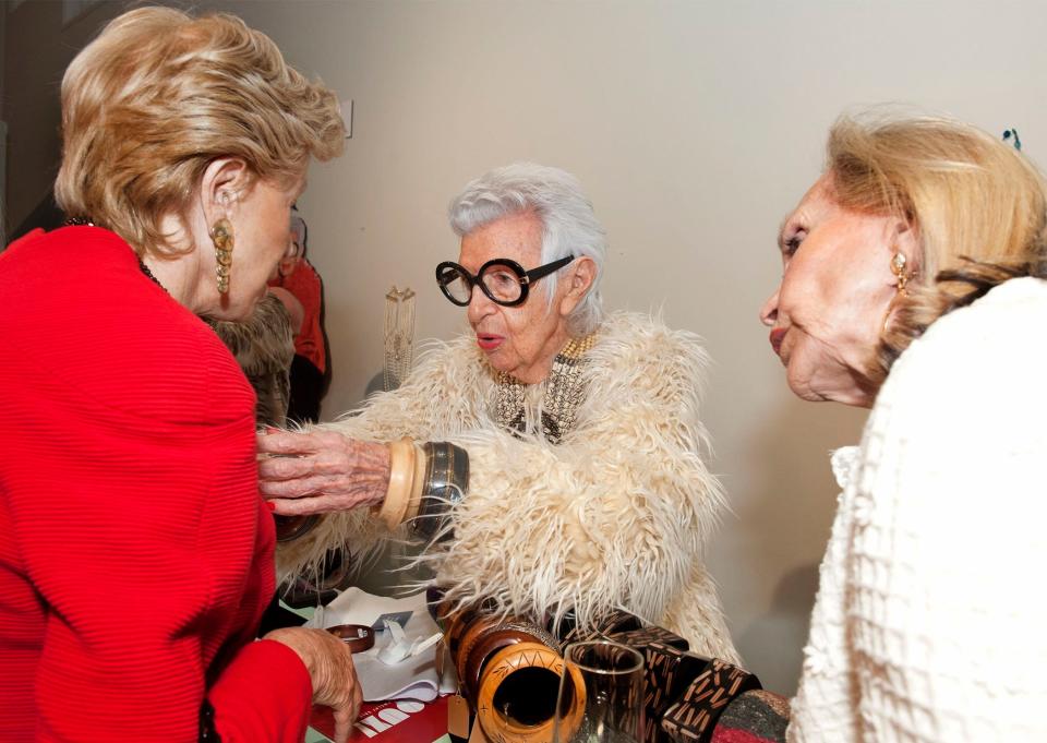 Iris Apfel sells jewelry during a party at the Armory Art Center in West Palm Beach, Fla., in 2020.