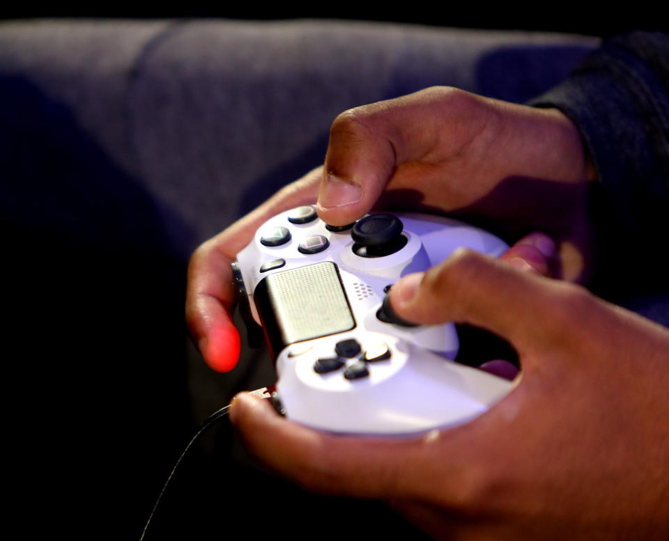 Save $18 on a full year of PlayStation Plus. (Photo: Getty Images)