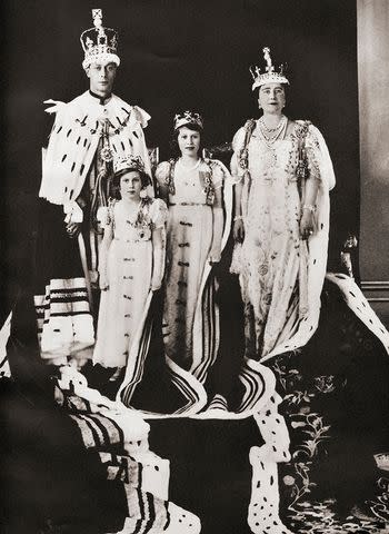 Universal History Archive/Universal Images Group via Getty King George VI and Queen Elizabeth on the day of their coronation, May 12, 1937, with Princess Margaret and Princess Elizabeth