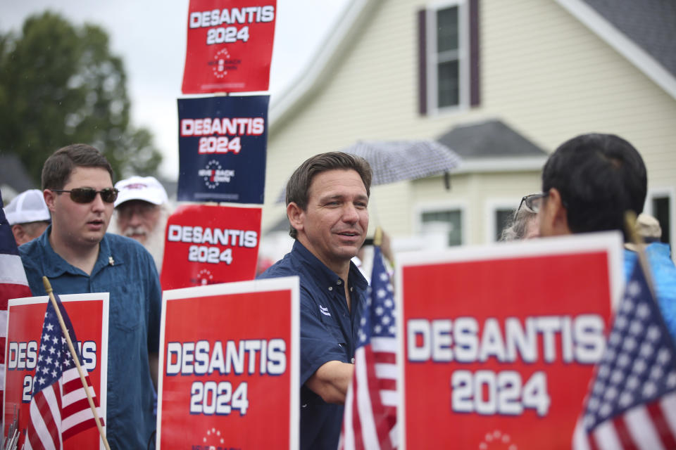 FILE - Republican presidential candidate and Florida Gov. Ron DeSantis, walks in the July 4th parade, July 4, 2023, in Merrimack, N.H. DeSantis is defending an anti-LGBTQ video his campaign shared online that attacks rival Donald Trump for his past support of gay and transgender people, despite some of his fellow Republicans calling it homophobic. (AP Photo/Reba Saldanha, File)