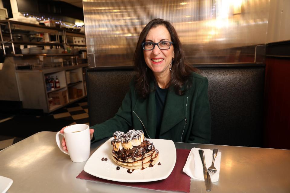Lohud Food and Dining Reporter Jeanne Muchnick with the S'mores Pancakes at the Breakfast and Burger Club in Nyack Nov. 9, 2023.