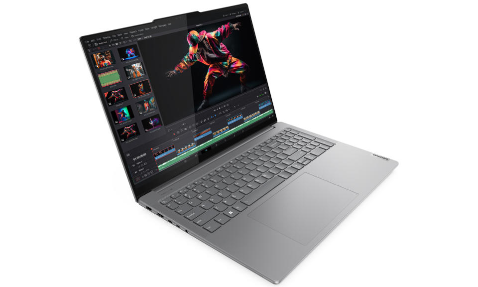 Product marketing photo of the Lenovo Yoga Pro 9i (16-inch) laptop. It sits at an angle (view from above and to the left), as it has image-editing software on its screen.