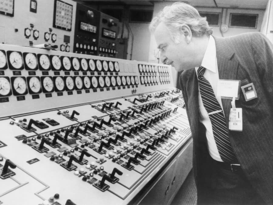 (Original Caption) 5/17/1979-Middletown, PA: John G. Kemeny, Chairman of the President’s Commissionon the Accident at tbhree Mile Island, inspects a long panel of switches as he toursthe control roomat the crippled nuclear power here 5/17. He and his commission made an extended tour of the plant as they begin their investigation in to the accident which closed the plant down 3/28 and released radiation in to the air causing the evacuation of children.