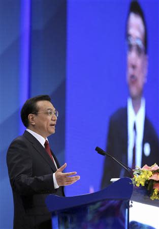 Chinese Premier Li Keqiang gestures as he gives a speech at the opening ceremony of the Boao Forum for Asia (BFA) Annual Conference 2014 in Boao, Hainan province April 10, 2014. REUTERS/China Daily