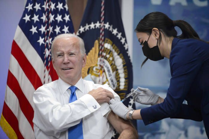 President Joe Biden receives an updated COVID-19 booster vaccine from a member of the White House Medical Unit in the South Court Auditorium of the Eisenhower Executive Office Building in Washington, D.C., on October 25, 2022.  File Photo by Bonnie Cash/UPI