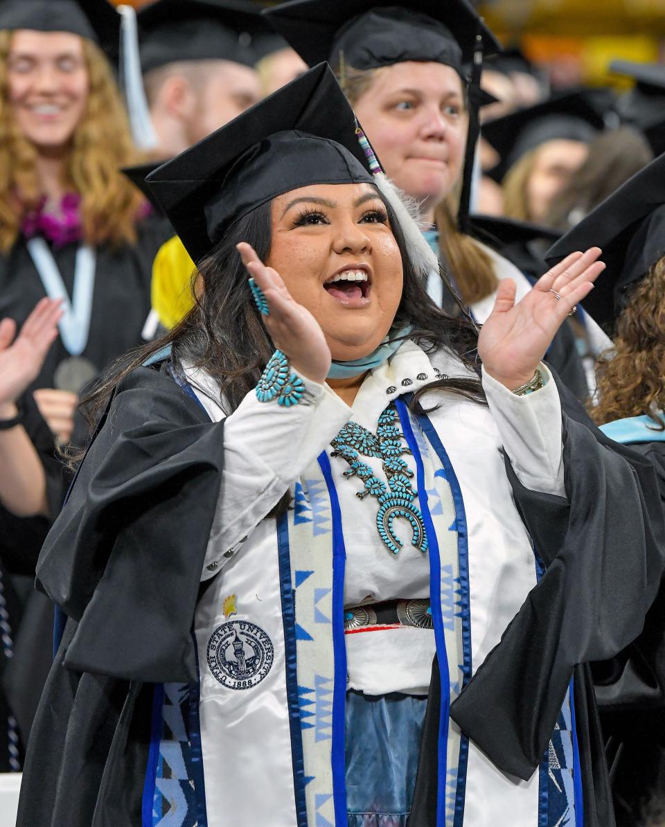 Alina Begay, of the Navajo Nation, celebrates during Utah State University’s commencement ceremony on Thursday, May 4, 2023, in Logan, Utah. | Eli Lucero, Herald Journal