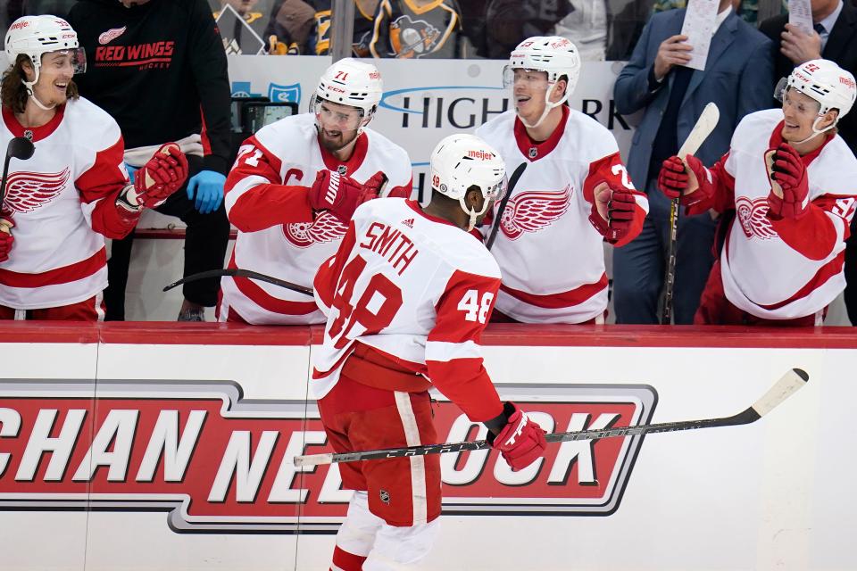Detroit Red Wings' Givani Smith (48) returns to the bench after scoring during the first period of an NHL hockey game against the Pittsburgh Penguins in Pittsburgh, Friday, Jan. 28, 2022.