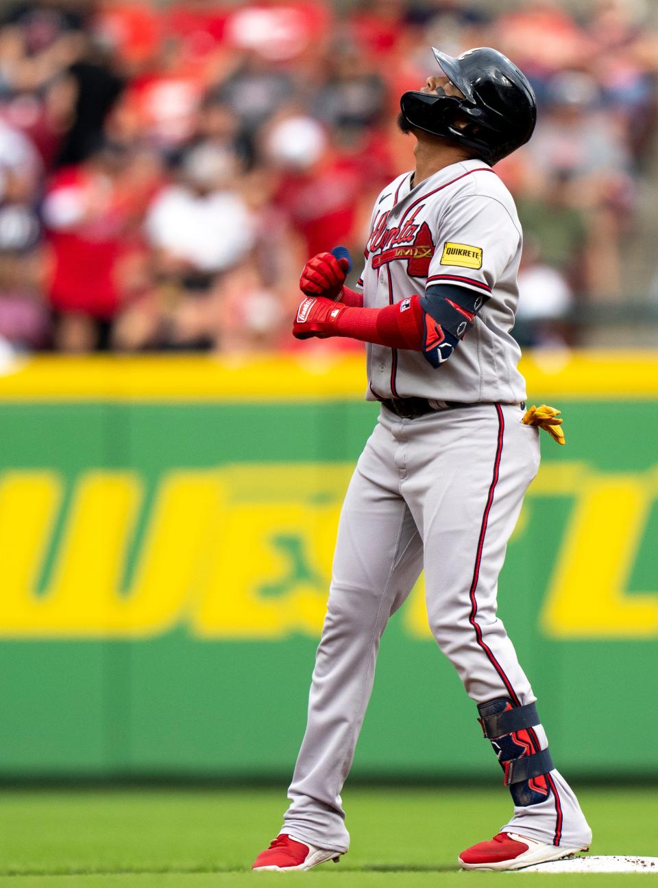 Atlanta Braves shortstop Orlando Arcia (11) reaches second base on a double in the first inning of the MLB baseball game between the Cincinnati Reds and the Atlanta Braves at Great American Ball Park in Cincinnati on Friday, June 23, 2023.