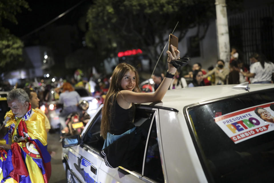 Supporters celebrate after former rebel Gustavo Petro won a runoff election in Bucaramanga, Colombia, Sunday, June 19, 2022. (AP Photo/Ivan Valencia)