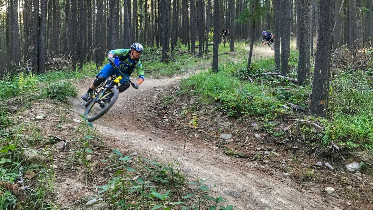 Jeff Woodgate rides one of the trails in the Moose Mountain trail system that could be affected by a logging project slated for the Bragg Creek area. (Submitted by Alberta 66 MTB - image credit)
