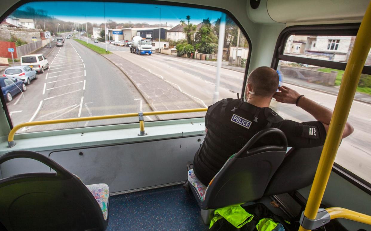 Police in Plymouth are using a double decker bus to spot motorists using mobile phones - SWNS.com