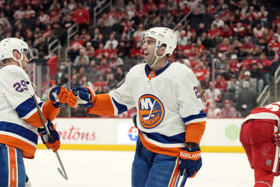 New York Islanders center Kyle Palmieri (21) greets teammate center Brock Nelson (29) after Nelson's goal during the third period of an NHL hockey game against the Detroit Red Wings, Thursday, Feb. 29, 2024, in Detroit. (AP Photo/Carlos Osorio)