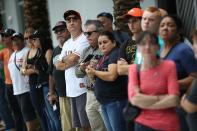 <p>People wait for the hearse carrying Miami Marlins pitcher Jose Fernandez to pass in front of the Marlins baseball stadium on September 28, 2016 in Miami, Florida. Mr. Fernandez was killed in a weekend boat crash in Miami Beach along with two friends. (Photo by Joe Raedle/Getty Images) </p>