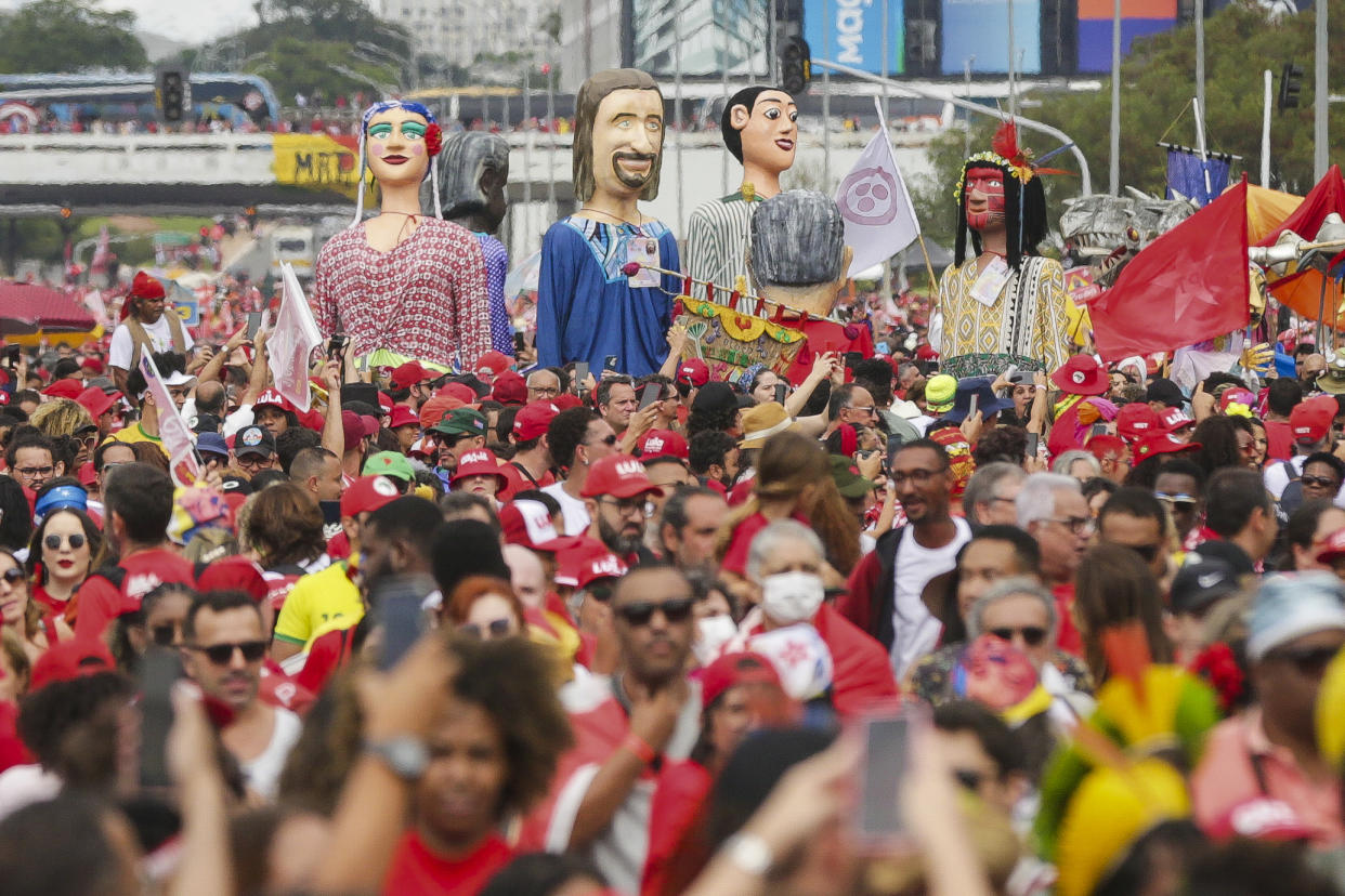 Supporters of President-elect Luiz Inacio Lula da Silva gather to attend his inauguration along the central avenue in Brasilia, Brazil, Sunday, Jan. 1, 2023. (AP Photo/Gustavo Moreno)