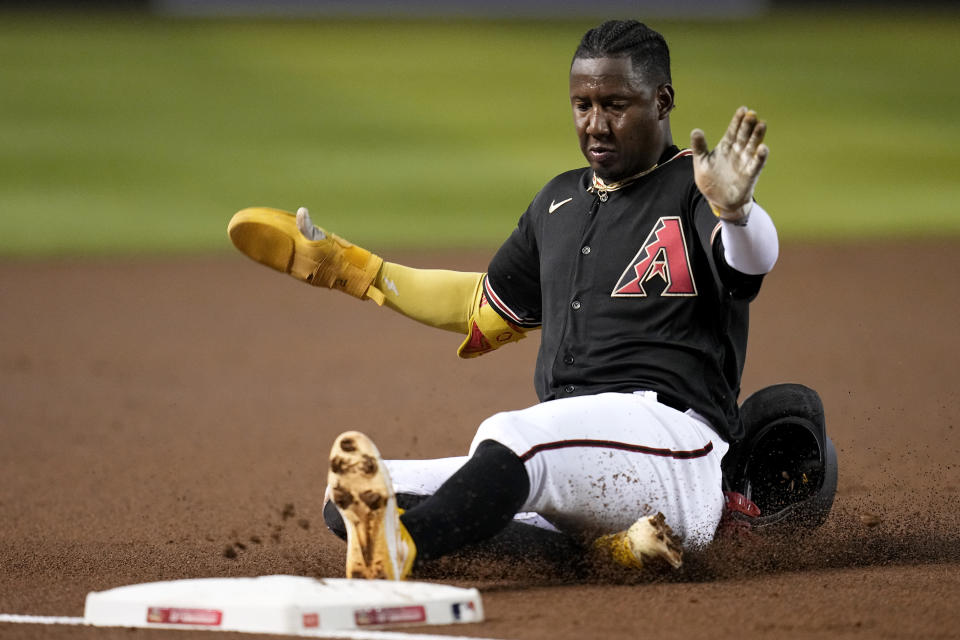 Arizona Diamondbacks' Geraldo Perdomo advances to third base against the St. Louis Cardinals during the first inning of a baseball game Monday, July 24, 2023, in Phoenix. (AP Photo/Ross D. Franklin)