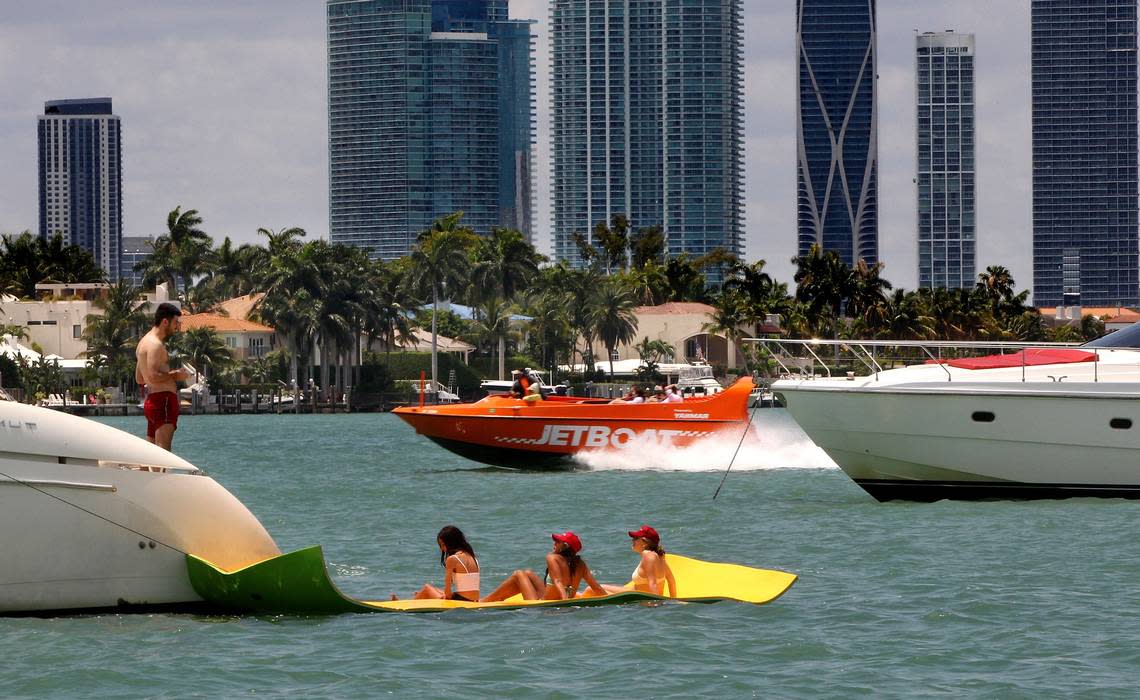 Boaters enjoy the sunny weather near Monument Island.