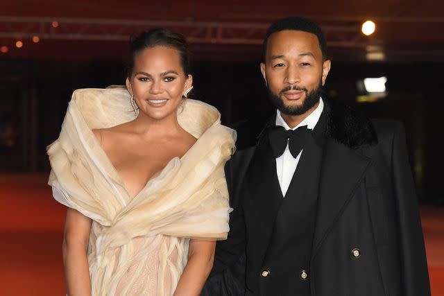 Chrissy Teigen poses in see-through tights in bed with hubby John Legend in  saucy Instagram snap