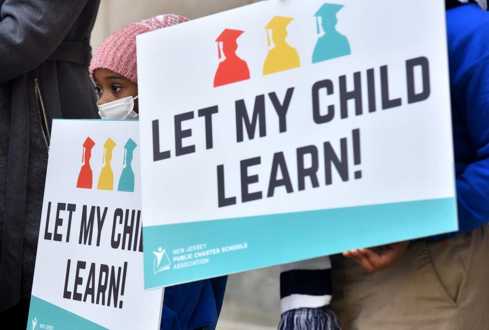 Loyalty Jones, 6, a student at Northstar Academy in Newark, listens to her mother, Jasmine Morrison speak during a rally outside of the New Jersey State House in Trenton on March 10, 2022, calling on Governor Phil Murphy and Acting Department of Education Commissioner Angelica Allen-McMillan to #LetMyChildLearn. Nine out of seventeen charter school expansion requests were denied by the DOE, according to the state charter school association. Of the 9 schools, the charter school association says 5 are Tier 1, and high performing. Some local school districts opposed expansions, while some low-income parents insist this is the best option for their children.The #LetMyChildLearn campaign was launched following the New Jersey Department of EducationÕs denial of expansions to top performing charter schools in the state.