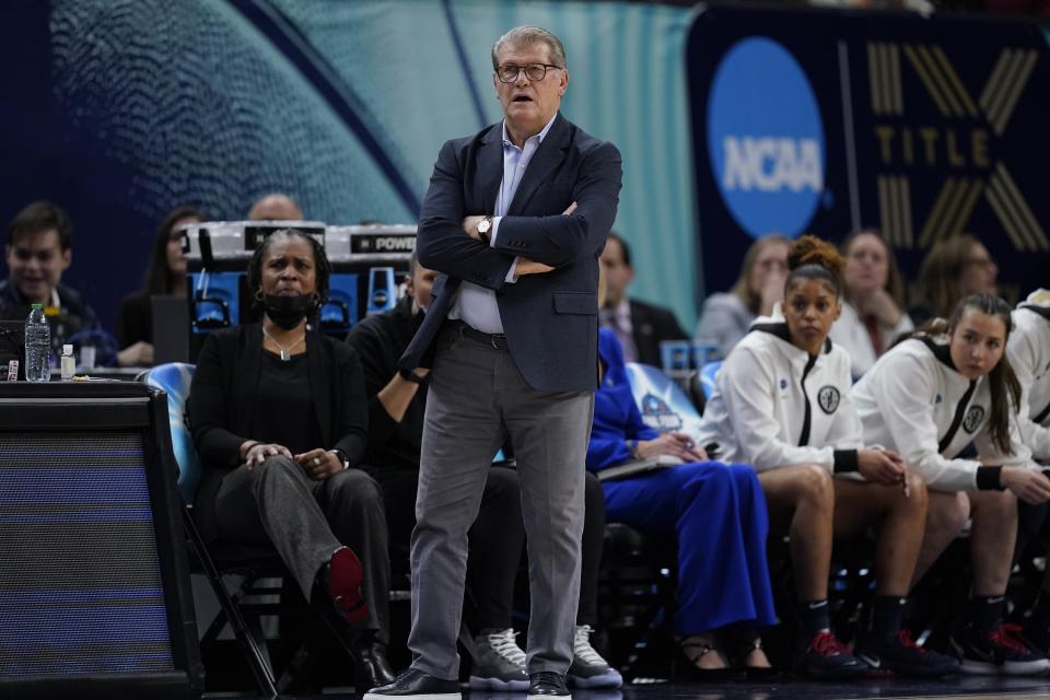 UConn head coach Geno Auriemma watches during the first half of a college basketball game in the semifinal round of the Women's Final Four NCAA tournament Friday, April 1, 2022, in Minneapolis. (AP Photo/Charlie Neibergall)