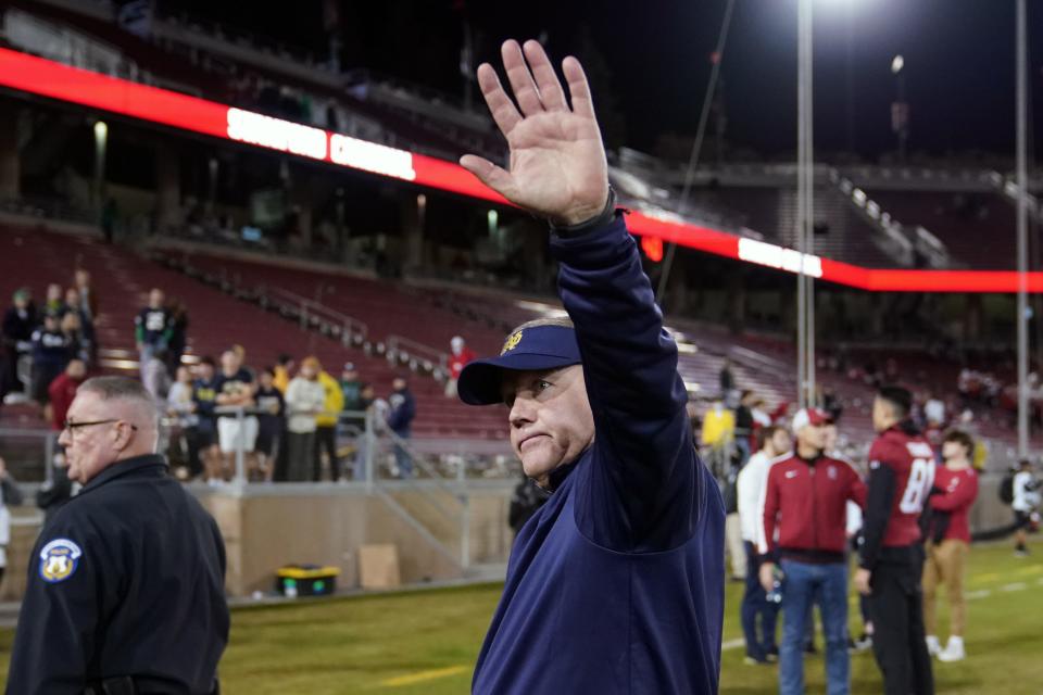 Brian Kelly walks off the field after Notre Dame's win against Stanford.