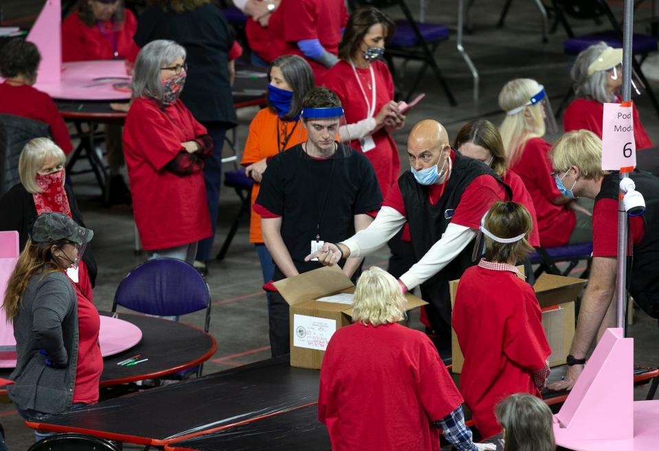 Contractors for Cyber Ninjas examine Maricopa County ballots at the Veterans Memorial Coliseum in Phoenix on May 24.