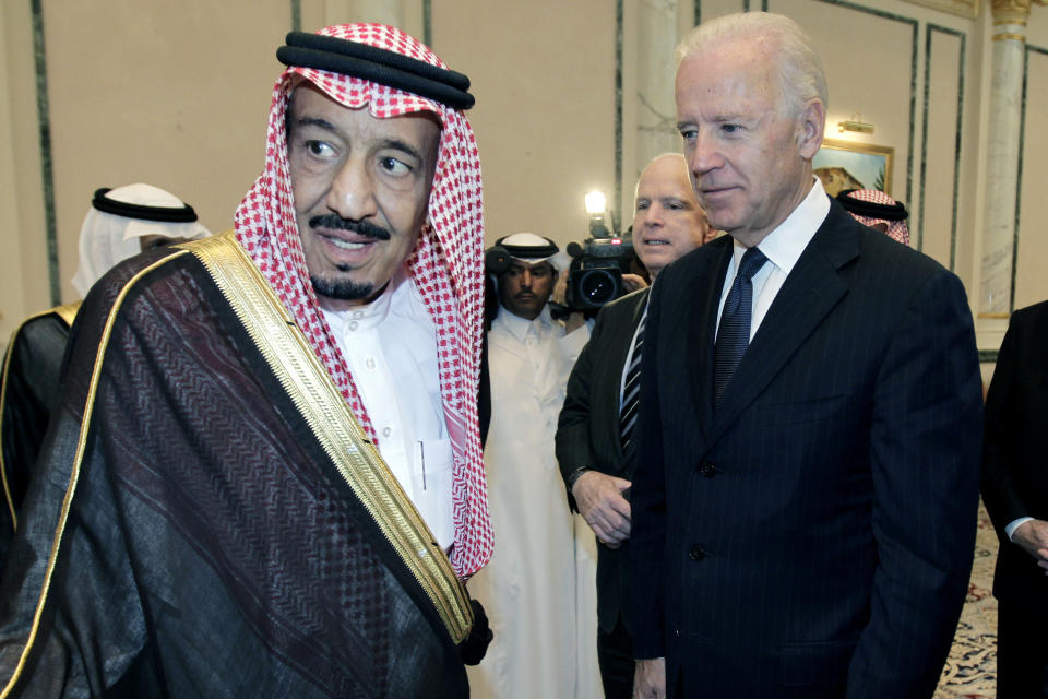 FILE - In this Oct. 27, 2011 file photo, then U.S. Vice President Joe Biden, right, offers his condolences to then Prince Salman bin Abdel-Aziz upon the death of his brother Saudi Crown Prince Sultan bin Abdul-Aziz Al Saud, at Prince Sultan palace in Riyadh, Saudi Arabia. President Joe Biden is expected to speak to Saudi King Salman for the first time in Biden’s just over a month-old administration. Coming as soon as Thursday, the conversation between the two strategic partners will be overshadowed by the expected release of U.S. intelligence findings on whether the king’s son approved the killing of a U.S.-based Saudi journalist. (AP Photo/Hassan Ammar)