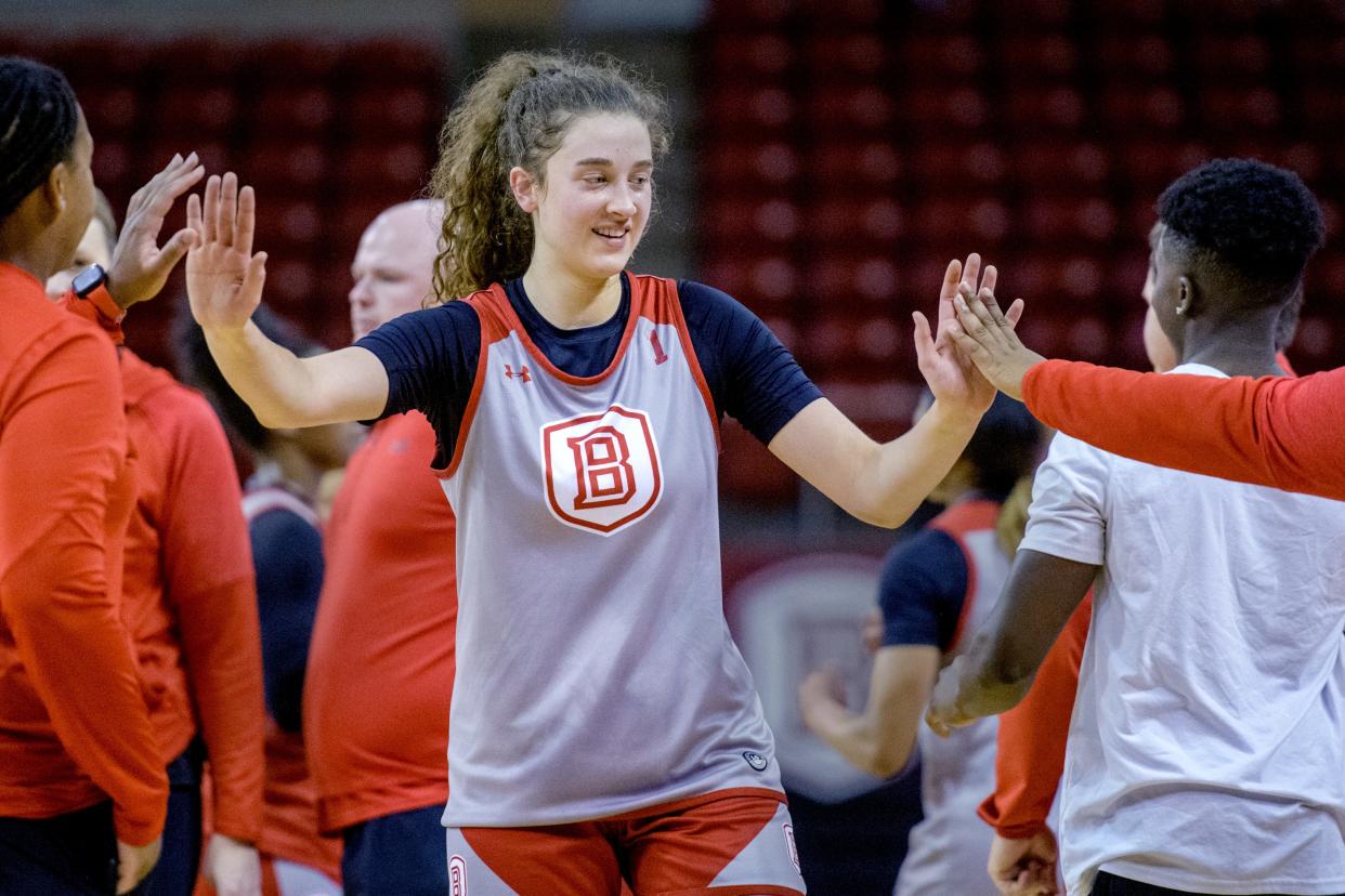 Washington grad Claire McDougall gets some high-fives after her debut with the Bradley women's basketball team in the annual Red-White scrimmage Saturday, Oct. 21, 2023 at Renaissance Coliseum.