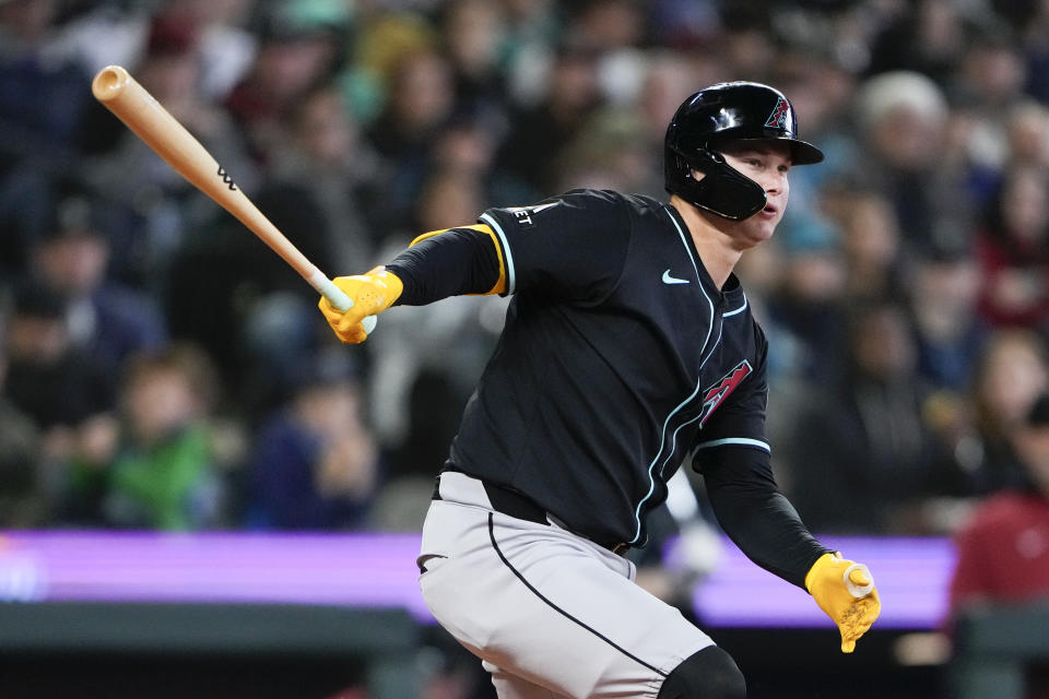 Arizona Diamondbacks' Joc Pederson hits a double against the Seattle Mariners during the seventh inning of a baseball game Sunday, April 28, 2024, in Seattle. (AP Photo/Lindsey Wasson)